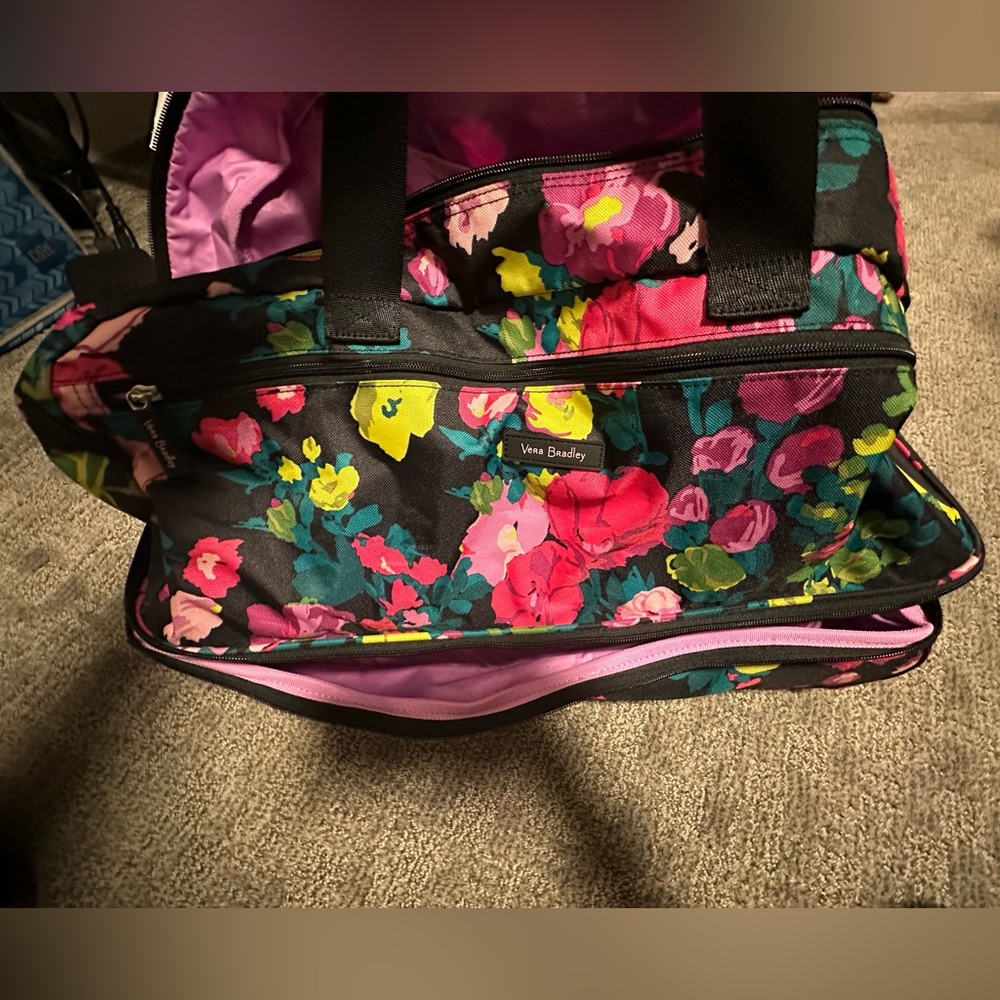 Like new! Used once as a carry on! Beautiful, bright, floral!